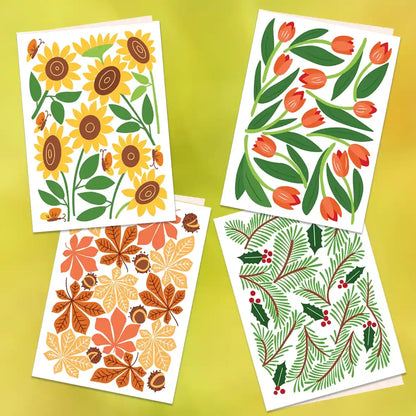 Kaartje met zonnebloemen, kaartje met tulpjes, kaartje met herfstbladeren en kaartje met kersttakjes