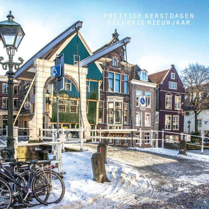 Kerstkaarten Alkmaar sneeuw huis met de kogel