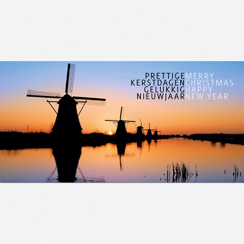 kerstkaart Kinderdijk molens bij ondergaande zon.